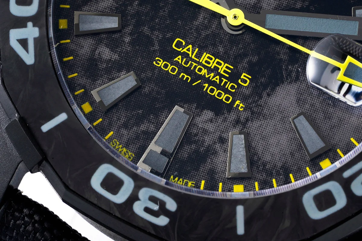 Aquaracer Calibre 5 Carbon Dial with Yellow Tachymeter